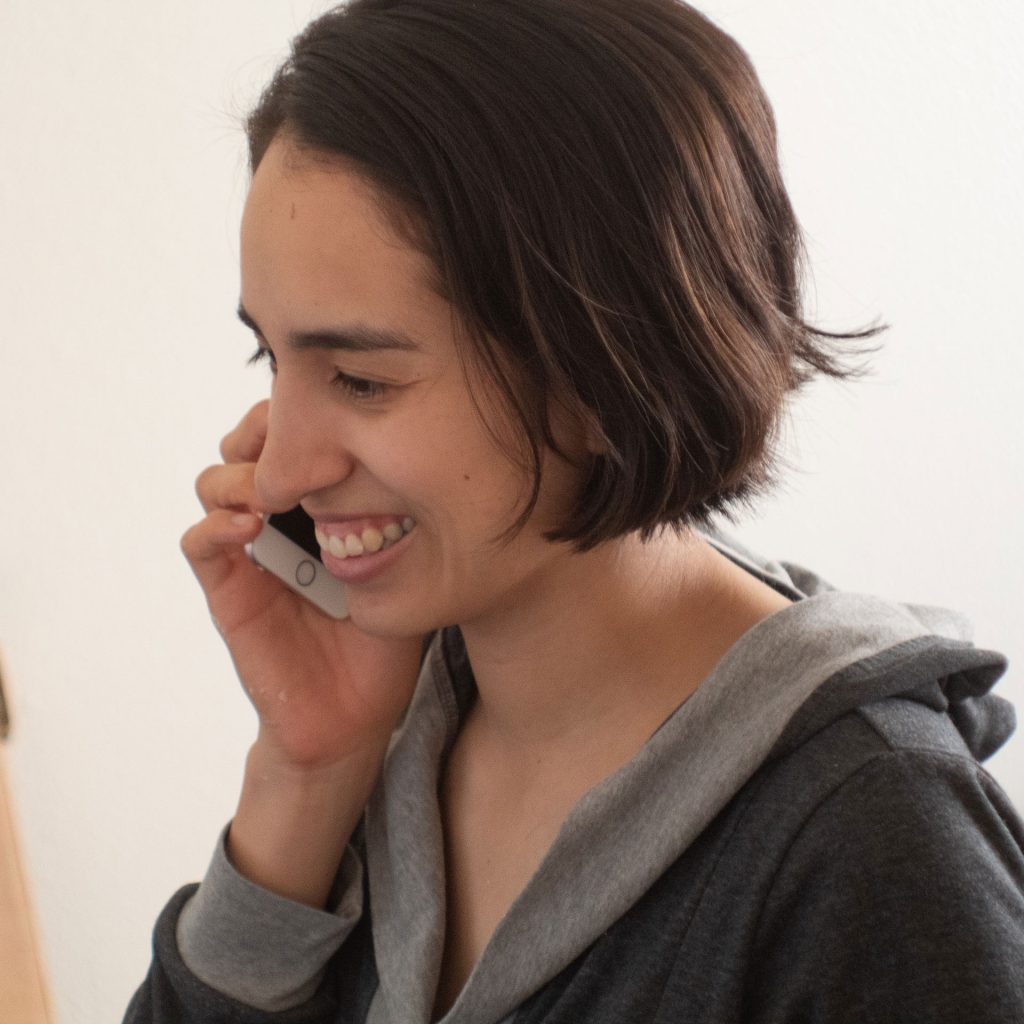 woman talking on mobile device