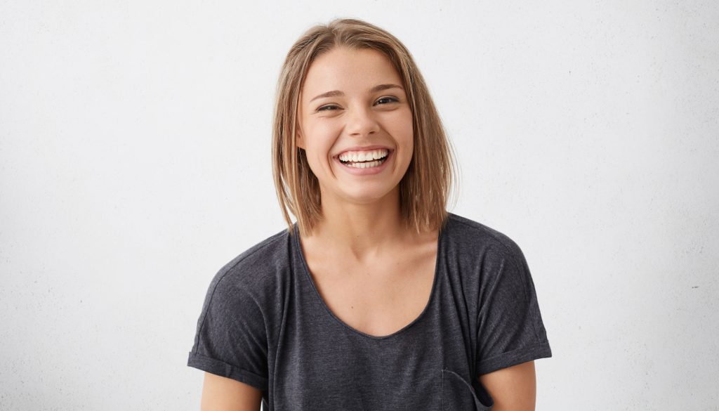 young female smiling, find a dentist