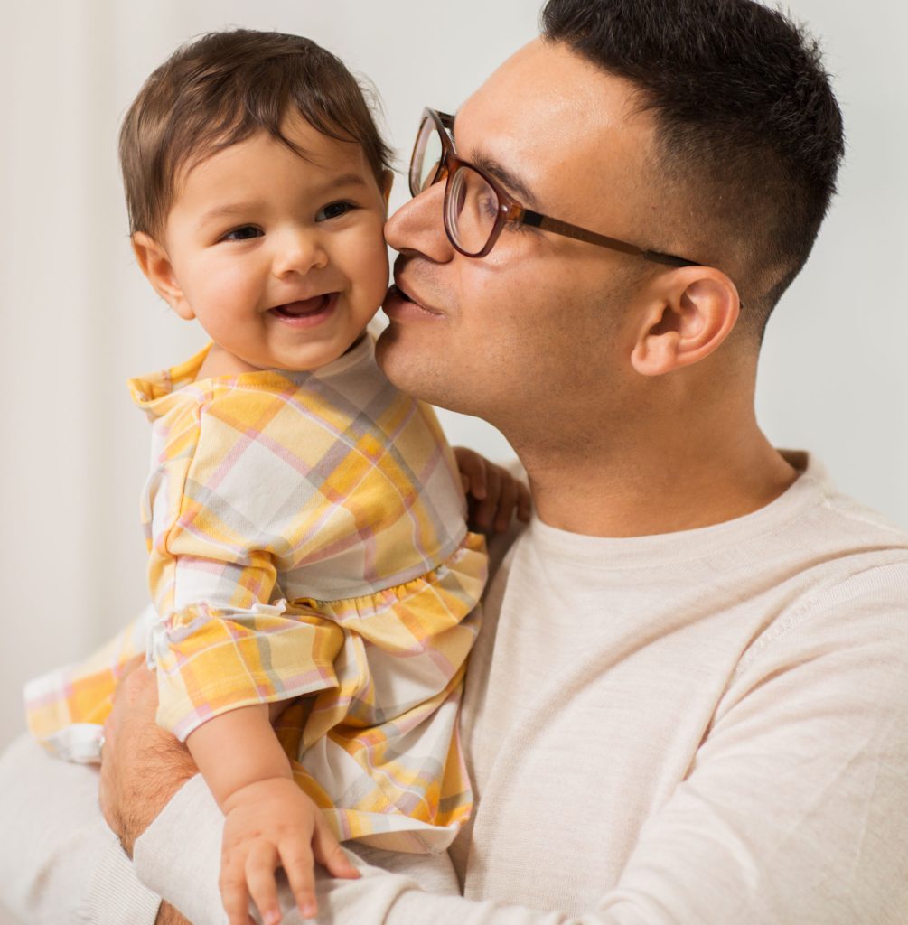 father holding smiling child