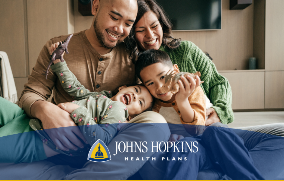 Family of four with new Johns Hopkins Health Plans logo