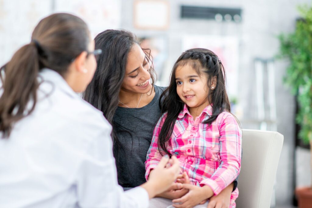 mother and daughter at an appointment with a doctor